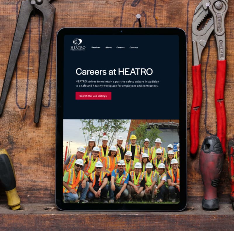 An ipad sitting on a shelf displaying the careers page on the Heatro website.