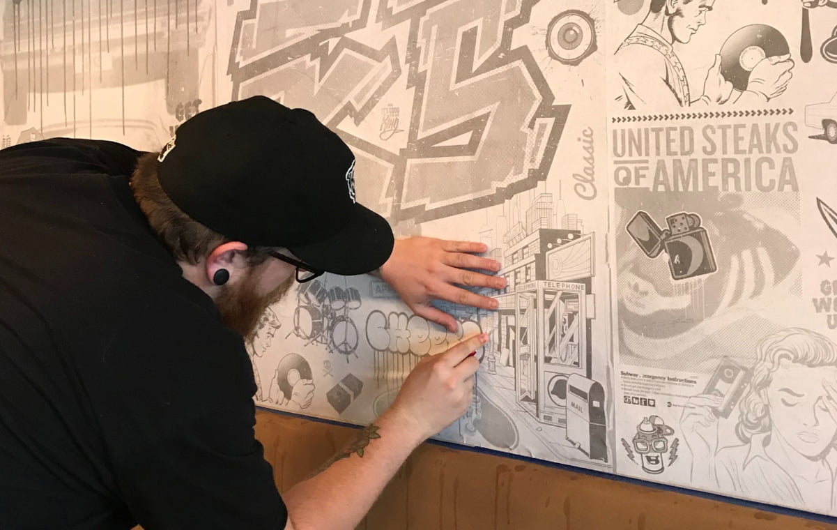 Martin working on the design of a greyscale wall