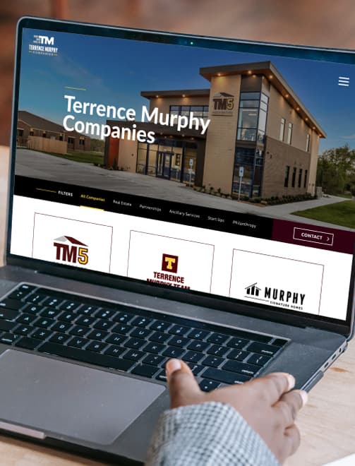 College Station Business: Terrence Murphy Companies - Responsive web design shown on a laptop